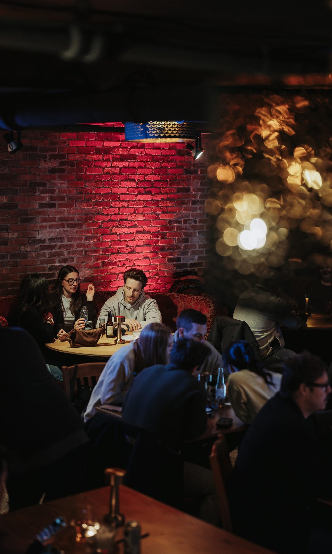 The Laugh Lounge showroom, red brick under stage light