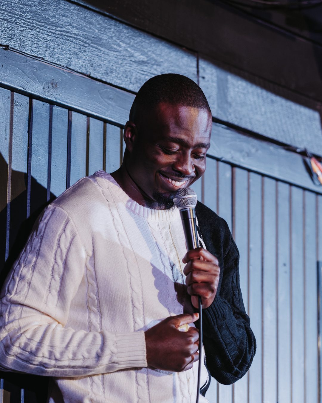 A comedian on the Laugh Lounge stage
