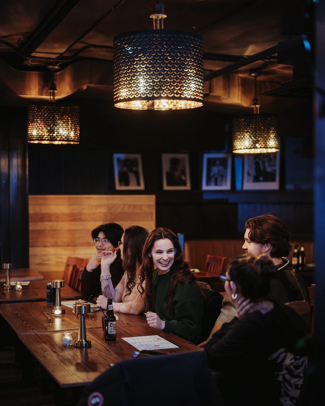 Tables with brass lamps in the Laugh Lounge showroom